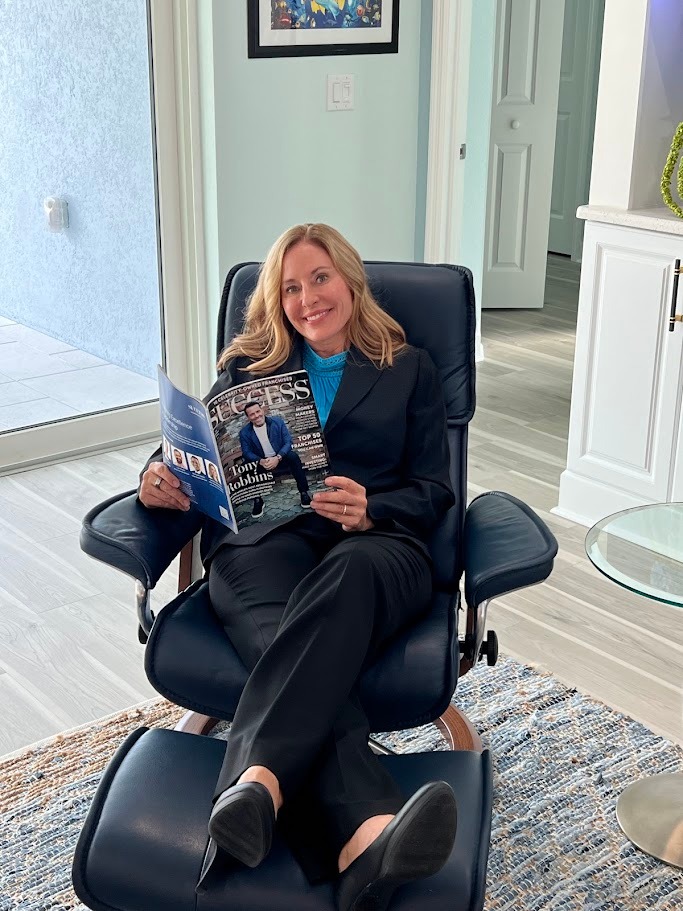 Debbie Weller reading a magazine